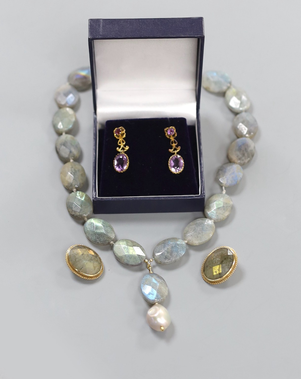A modern 9ct mounted labradorite necklace and pair of ear clips, Opal necklace and earrings and a pair of pinch beck and amethyst set drop earrings.